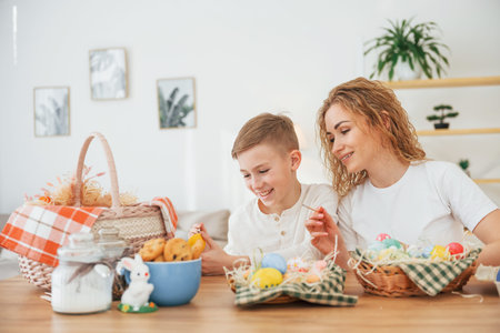 Happy mother and son celebrating Easter holidays together.