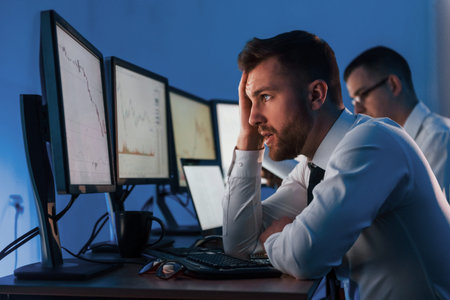 Concept of failure. Two stock traders working in the office with exchange technology.