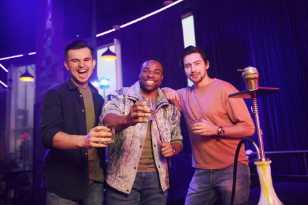 Partying all night long. Group of friends having fun in the night club together.