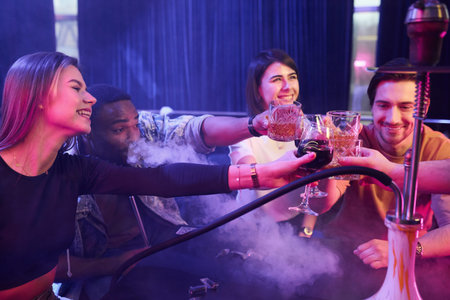 Positive emotions. Group of friends having fun in the night club together.