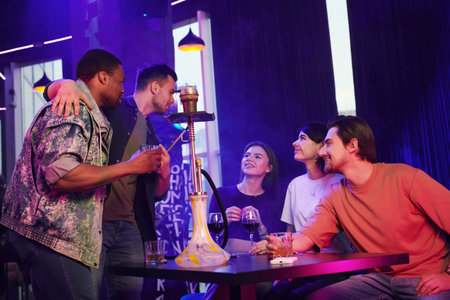 Positive emotions. Group of friends having fun in the night club together.
