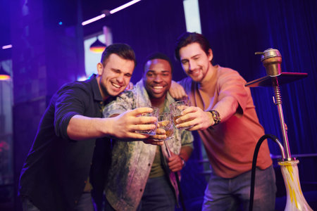 Enjoying free time in the night club. Group of friends having fun together.