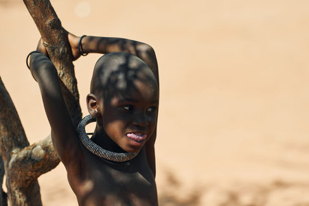 Namibia, Africa - June 14, 2021: Child of the ethnic people of Africa is outdoors.