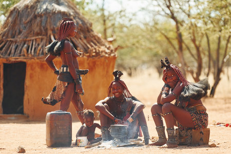 Namibia, Africa - June 14, 2021: People of the ethnic people of Africa is outdoors. Adult category. Near homes.のeditorial素材