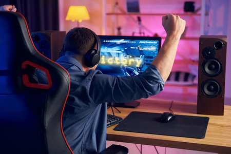 Man wins this game. Online streamer playing FPS shooter at home.