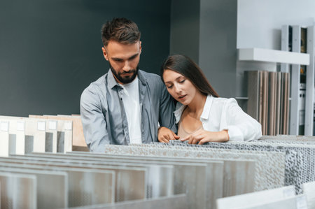 Indoors together. Woman and man is in the store of goods for the home.の写真素材