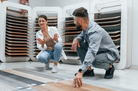 Girlfriend don't like this color. Woman and man is in the store of goods for the home.の写真素材