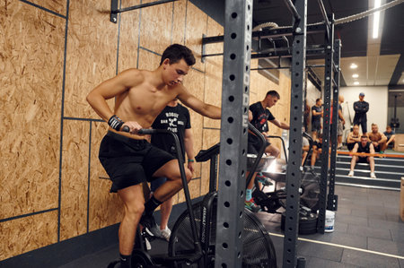Ternopil, Ukraine - August 20, 2022: Sportive competition in the gym. Endurance exercise on bicycle.のeditorial素材