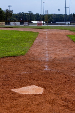 A view down the baseline from home plate to first base at a public baseball field in Montgomery, TX.