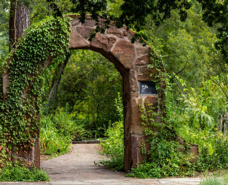 A stone archway leading to a secret garden in Spring, TXの写真素材