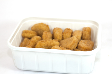 Diced chicken nuggets breaded ready for eatingの写真素材