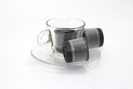 Transparent cup of coffee with wafflesの写真素材