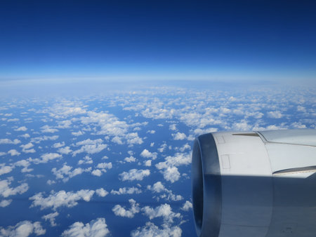 Looking through window aircraft During flight in wing with a nice blue sky