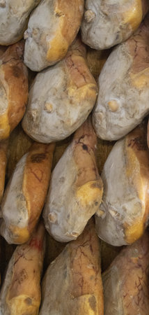 pork leg hams hung for vertical seasoning