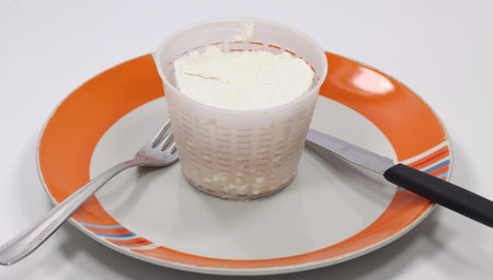 small buffalo ricotta cheese with tray