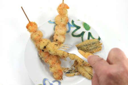 skewers of crustaceans and fishの写真素材