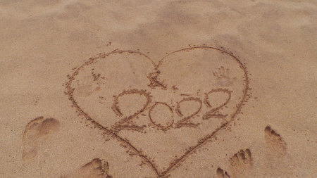 heart drawing on the sand happy new year 2022 -