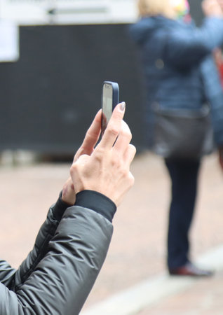 people with mobile phones do selfiの写真素材