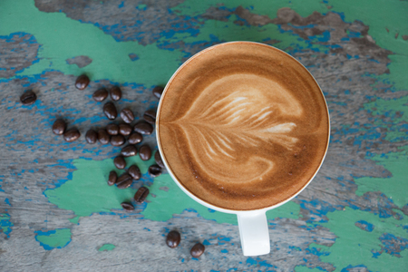 Morning with hot coffee latte on a wooden table.の写真素材