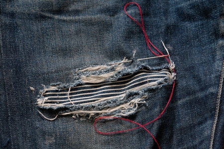 Repair your favorite jeans re-use to see cool.の写真素材