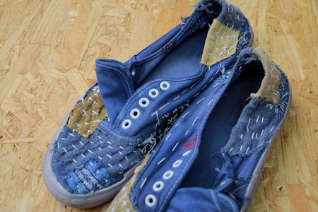 Japanese way of using cloth to embroidery. The old rattling cracked. The art of matching denim with cotton that is indigo mainly as a bag, shoes, hat.の写真素材
