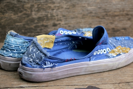Japanese way of using cloth to embroidery. The old rattling cracked. The art of matching denim with cotton that is indigo mainly as a bag, shoes, hat.の写真素材
