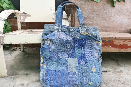 Japanese way of using cloth to embroidery. The old rattling cracked. The art of matching denim with cotton that is indigo mainly as a bag, shoes, hat.の写真素材