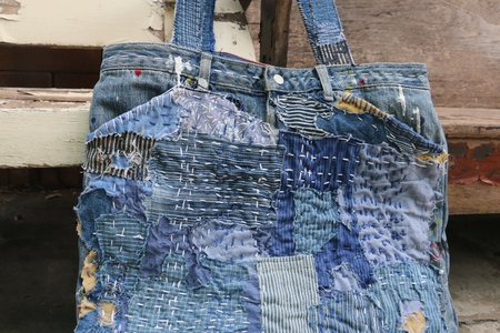 Japanese way of using cloth to embroidery. The old rattling cracked. The art of matching denim with cotton that is indigo mainly as a bag, shoes, hat.の写真素材