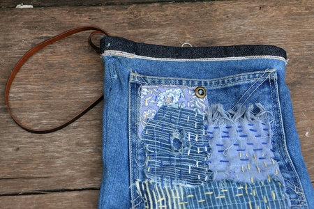 Japanese way of using cloth to embroidery. The old rattling cracked. The art of matching denim with cotton that is indigo mainly as a bag, shoes, hat.の写真素材