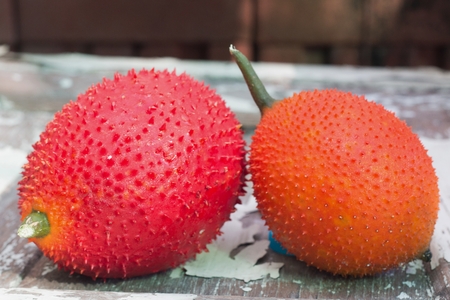 Fruit of the Asian region. The spiny nature is fresh. The ball is green. The harvest will be orange red. Bring a picture of fruit juice is sweet to the politeの写真素材
