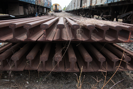 Old trains are parked outdoors where they are exposed to the heat of sunlight and rain, resulting in cracking and rusting.の写真素材