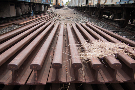 Old trains are parked outdoors where they are exposed to the heat of sunlight and rain, resulting in cracking and rusting.の素材 [FY31076418543]