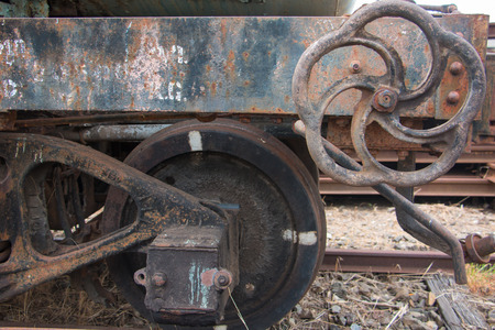 Old trains are parked outdoors where they are exposed to the heat of sunlight and rain, resulting in cracking and rusting.の写真素材