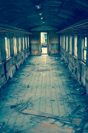 Old trains are parked outdoors where they are exposed to the heat of sunlight and rain, resulting in cracking and rusting.の写真素材