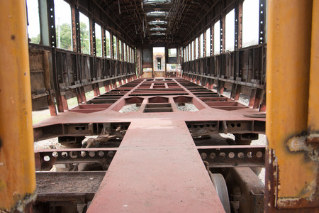 Old trains are parked outdoors where they are exposed to the heat of sunlight and rain, resulting in cracking and rusting.の写真素材