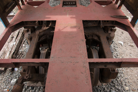 Old trains are parked outdoors where they are exposed to the heat of sunlight and rain, resulting in cracking and rusting.の写真素材