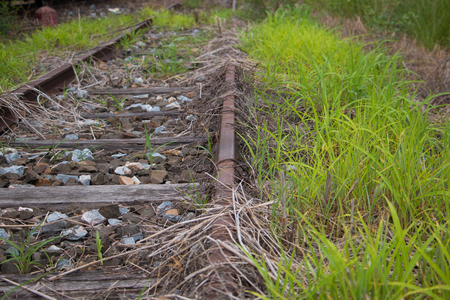 Old trains are parked outdoors where they are exposed to the heat of sunlight and rain, resulting in cracking and rusting.の写真素材