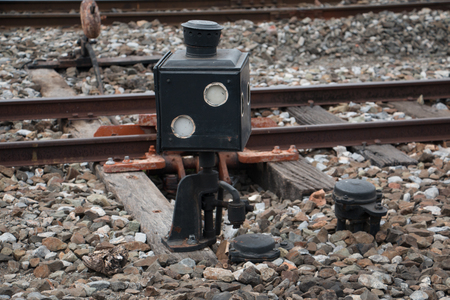 Old trains are parked outdoors where they are exposed to the heat of sunlight and rain, resulting in cracking and rusting.の写真素材