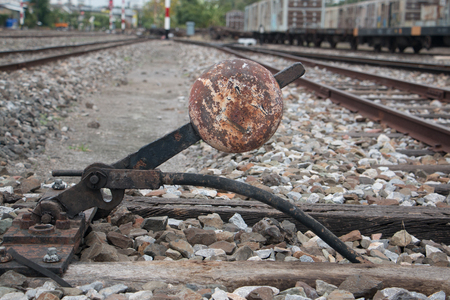 Old trains are parked outdoors where they are exposed to the heat of sunlight and rain, resulting in cracking and rusting.の写真素材