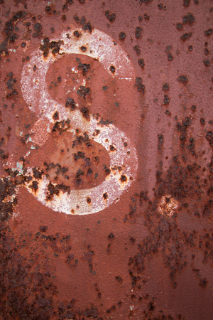 Old trains are parked outdoors where they are exposed to the heat of sunlight and rain, resulting in cracking and rusting.の写真素材