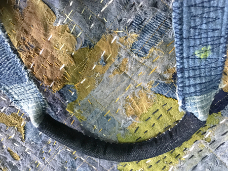 Technicians are doing genes in Japanese style. The work will come out as a tailor cut into a sewing together called a roo. Use cotton denim with blue indigo, yellow brown, red perfectly.の写真素材