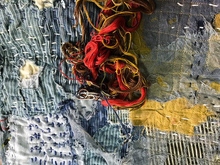 Technicians are doing genes in Japanese style. The work will come out as a tailor cut into a sewing together called a roo. Use cotton denim with blue indigo, yellow brown, red perfectly.の写真素材