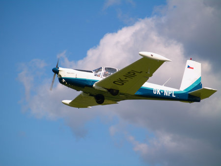 small airplane in the skyの写真素材