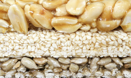 Brittles sesame, sunflower seeds and peanuts closeupの写真素材