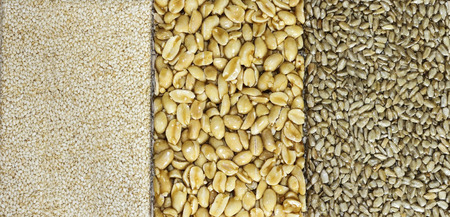 Brittles sesame, sunflower seeds and peanuts closeupの写真素材