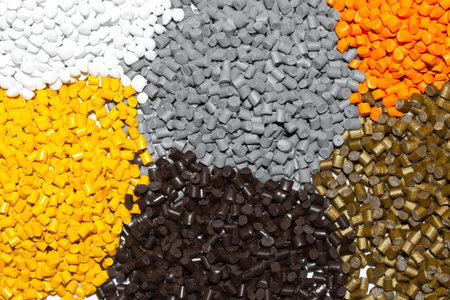 The plastic granules. Dye for polypropylene, polystyrene granules into a measuring container