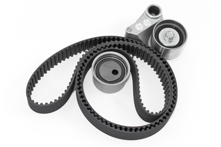 Spare parts for the ca r. Kit of timing belt with rollers on a light background.の写真素材