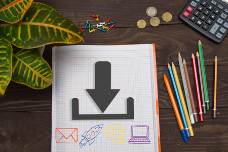 Notebook with a notes download on the office table with tools. Concept with elements of infographics.の写真素材