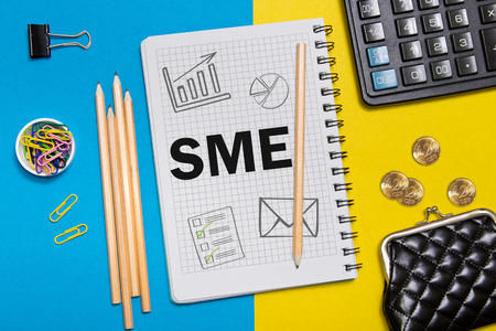Small and Medium Enterprise, SME notes in the notebook on the Desk of a businessman in office. Business concept SME.の写真素材