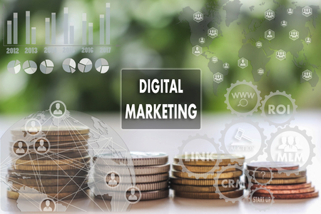 DIGITAL MARKETING on the touch screen with a  blur financial background .The concept DIGITAL MARKETINGの写真素材